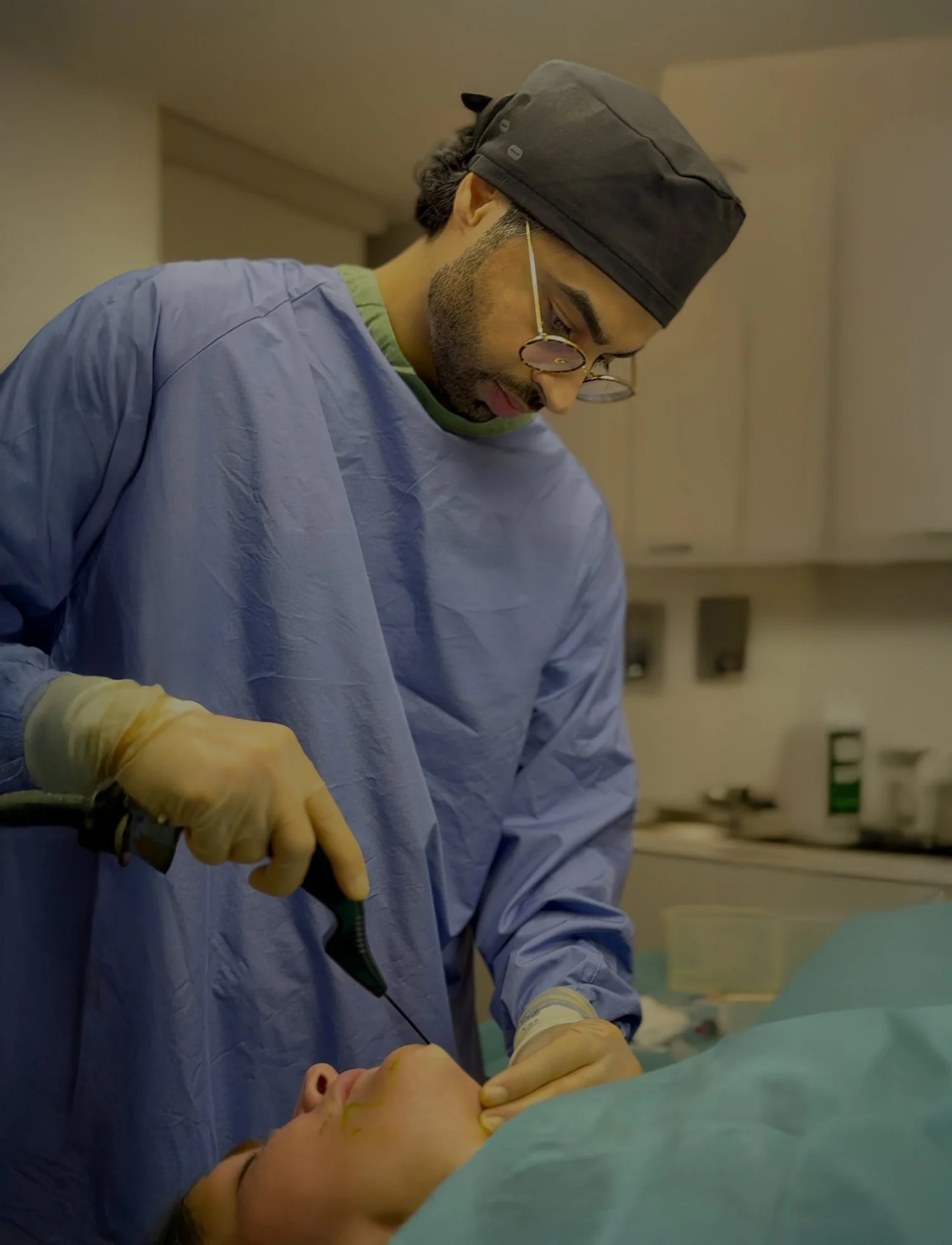 Dr Sultan carrying out a procedure at his clinic in Chelsea
